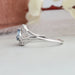 Side view of pear shaped diamond ring se                          t in split shank, this engagement ring crafted with 14k white gold & VS clarity.