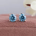 These stunning Blue Round Diamond Solitaire Stud Earrings are elegantly crafted to add a touch of glamour to any outfit