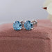 Fancy blue colored diamond earrings made with round brilliant cut lab created diamonds in white gold