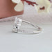 Round diamonds studded on 14k white gold shank of bypass diamond ring