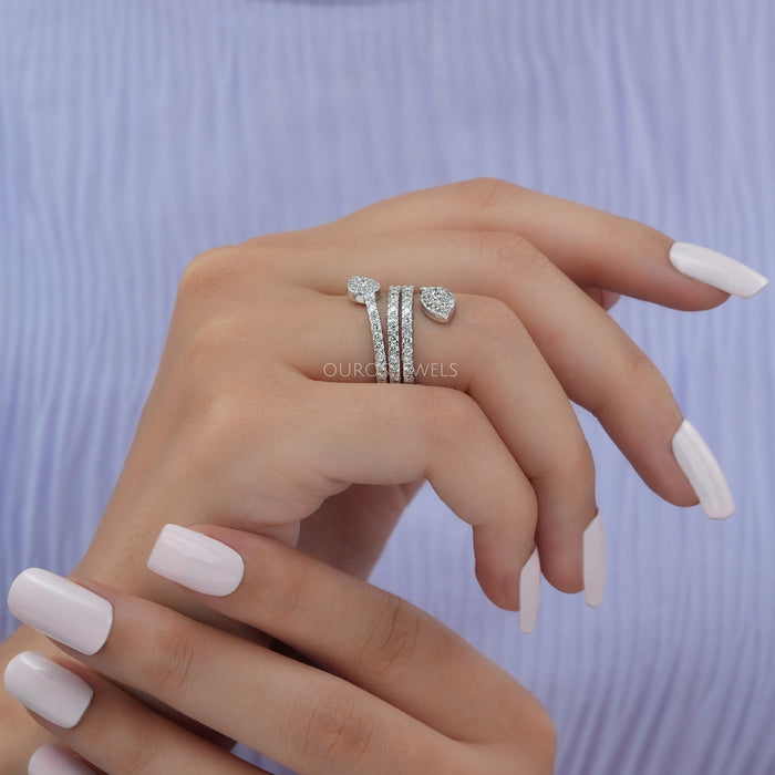 Slightly folded in finger view of Round Diamond Cluster Ring made of 14k white gold.