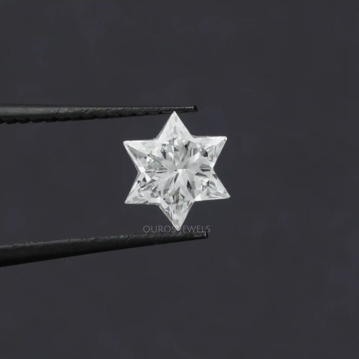 In tweezer look of star cut lab grown diamond