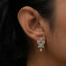 In ear look of flower style lab created diamond earrings with halo design and drop style