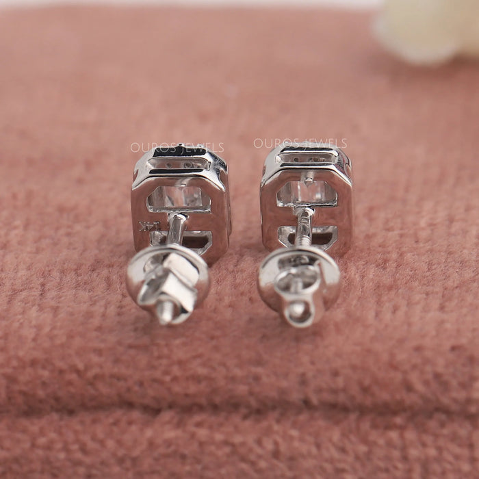 Back view of stud earrings set in emerald cut, this halo earrings in 14k white gold.