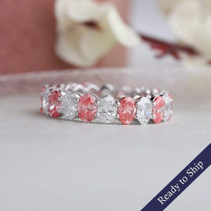 Front view of oval eternity band set in pink & colorless diamonds, this band crafted in 14k white gold.