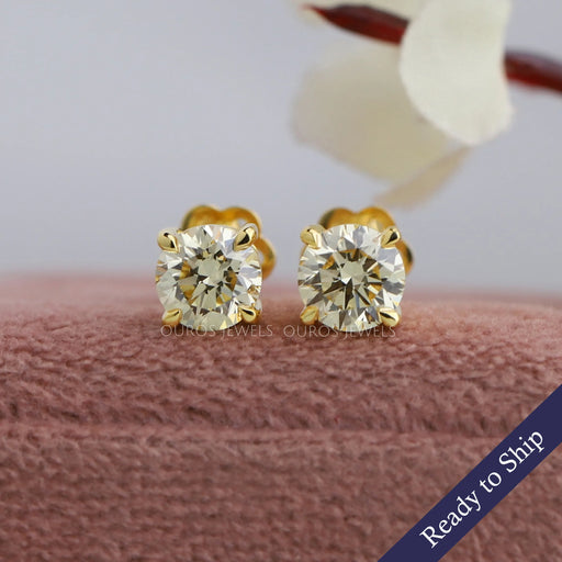 Yellow gold round brilliant cut lab diamond stud earrings in VS clarity and claw prongs