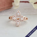 Flower shaped lab grown diamond engagement ring with pear shaped diamond in halo setting set in 14k rose gold