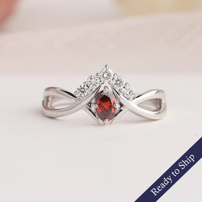 Front view lab made red oval shaped diamond with small round diamonds, this infinity ring crafted with 14k white gold & VS clarity.