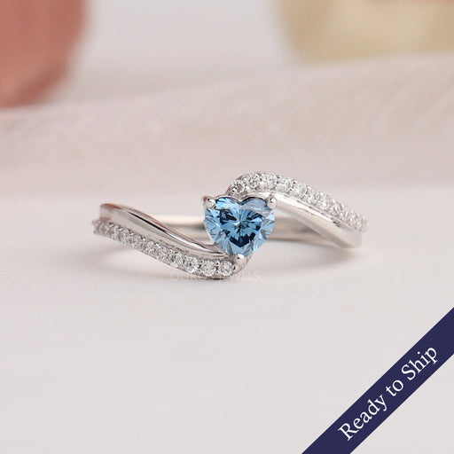 Front view of heart shaped engagement ring set in bypass.