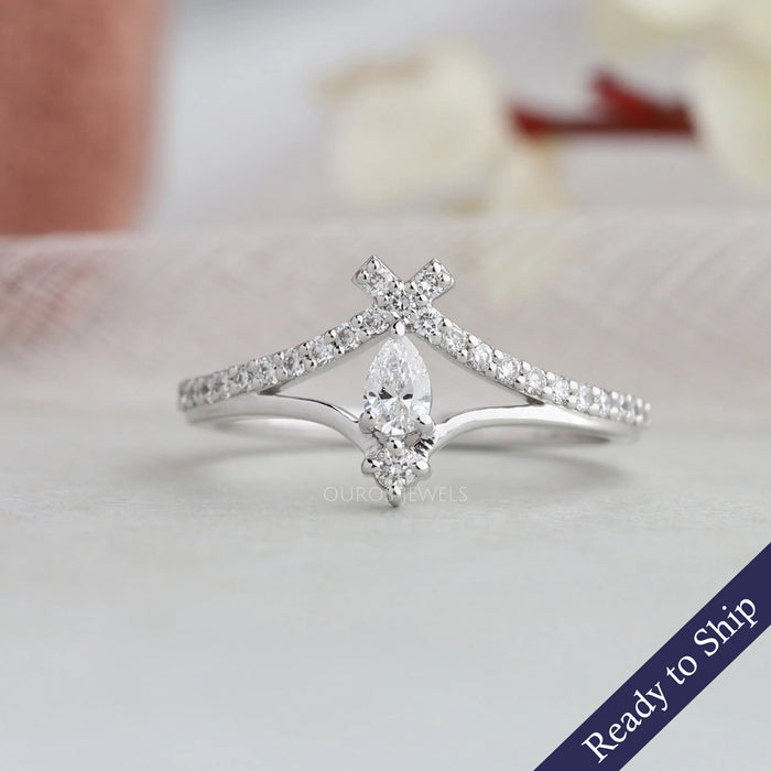 Pear and round lab grown diamond engagement ring with curved shank style