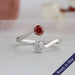Red round brilliant cut lab diamond engagement ring with a exceptional curved bypass setting shank