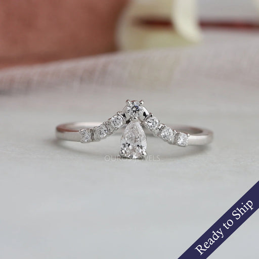 Pear shaped diamond wedding band with a curved band studded with round diamonds
