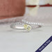 Yellow pear shaped lab grown diamond engagement ring with bypass setting curved shank in 14k solid white gold