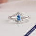 Blue pear shaped lab grown diamond wedding ring with split shank in 14k white gold