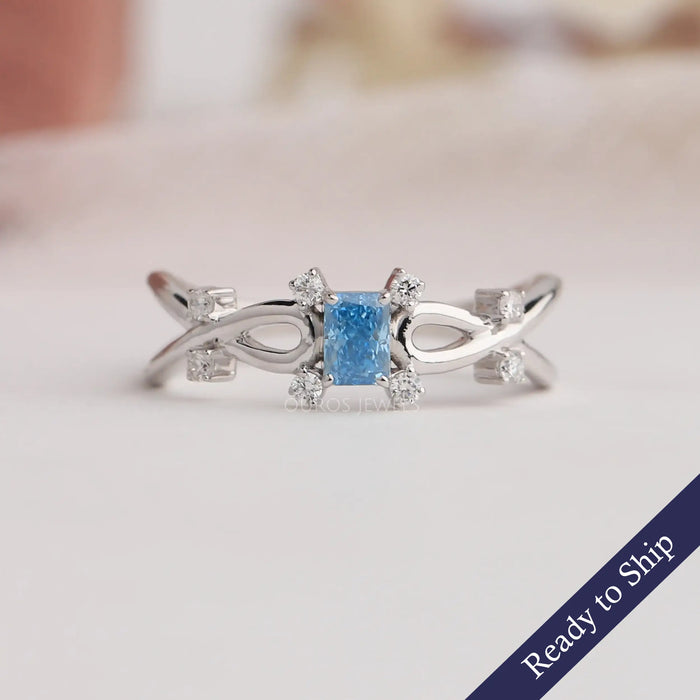 Blue radiant cut lab grown diamond engagement ring with exquisite infinity design