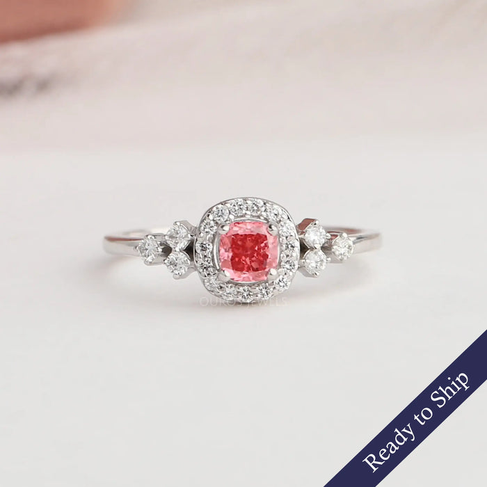 Pink cushion lab grown diamond engagement ring with a lovely halo of round diamonds in 14k white gold