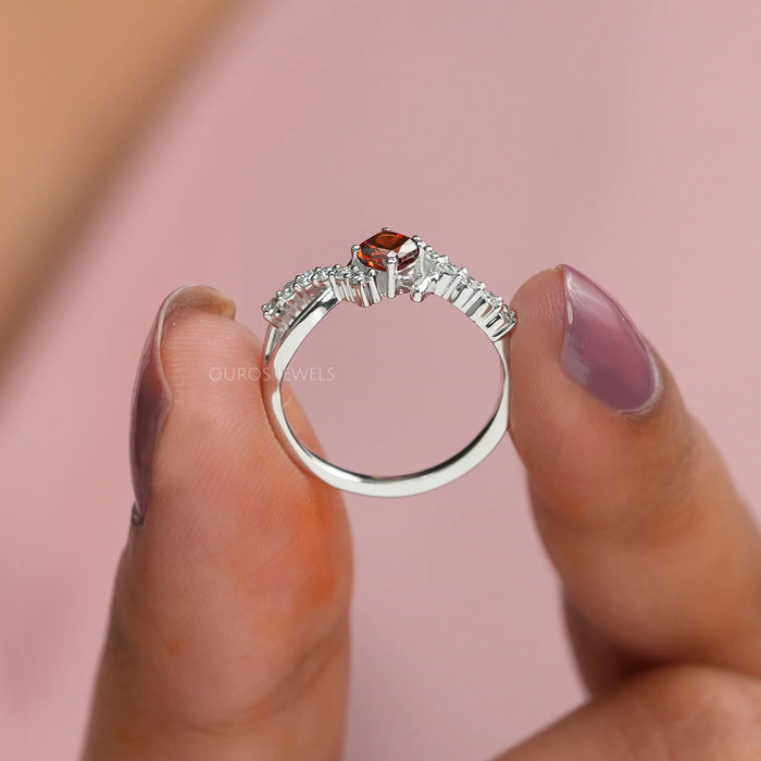 Zoomed look of fancy vivid orange engagement ring with cushion cut eco-friendly lab diamonds