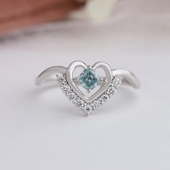 Close up look of cushion cut engagement ring with heart shape style.