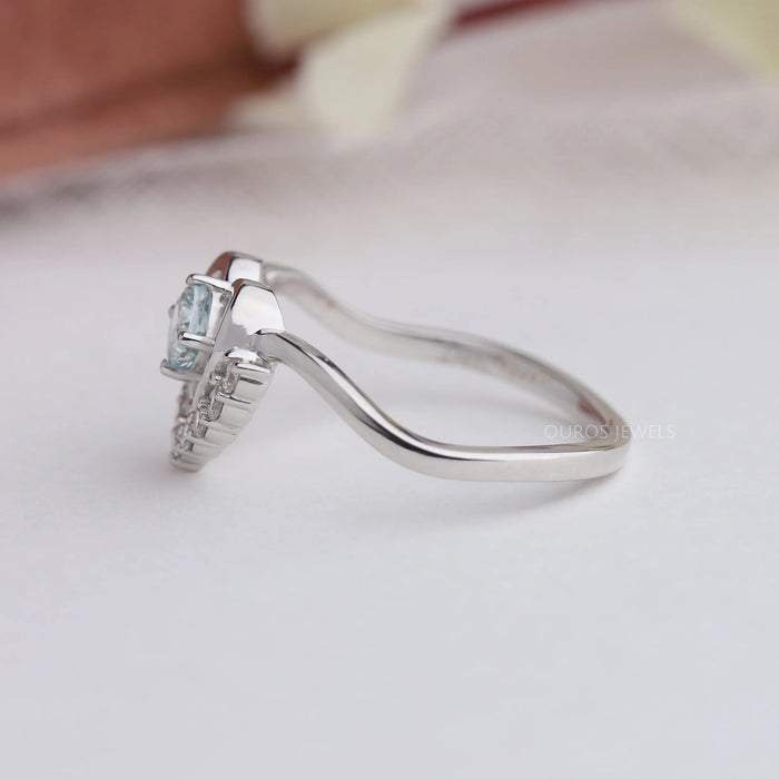 Side view of cushion cut diamond engagement ring crafted with half halo setting.