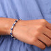 [A Women wearing Blue Sapphire Cushion Diamond Bracelet]-[Ouros Jewels]