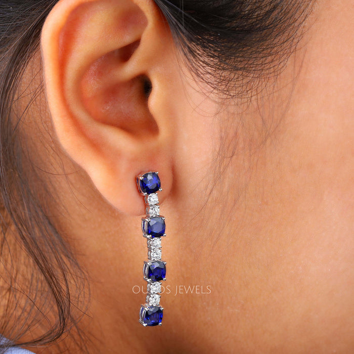 [A Women wearing Blue Cushion Cut Diamond Earrings]-[Ouros Jewels]