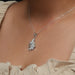 On neck side look of Round lab diamond pendant in white gold