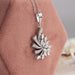 Marquise cluster pendant in leaf shape with marquise and round diamonds