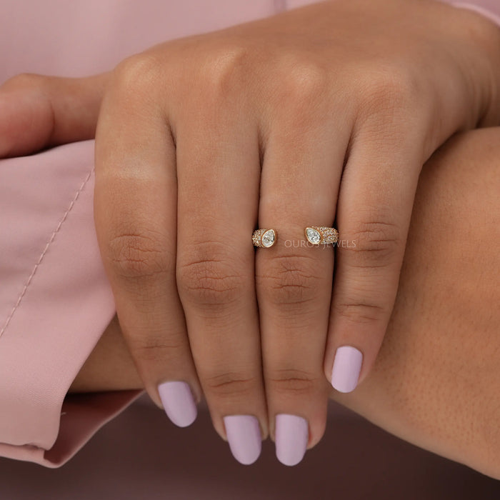 Pear shape lab created diamond band with round studded diamonds on shank