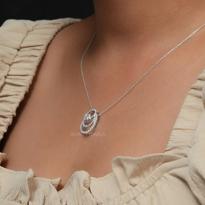 On neck side look of oval diamond pendant necklace
