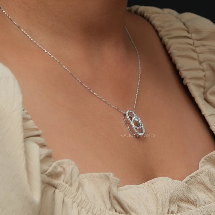 On neck left side look of round diamond cluster pendant