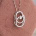 Side look of 14k white gold oval cut lab made diamond pendant