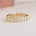 Brilliant oval cut lab made diamond eternity ring with prongs set in solid yellow gold