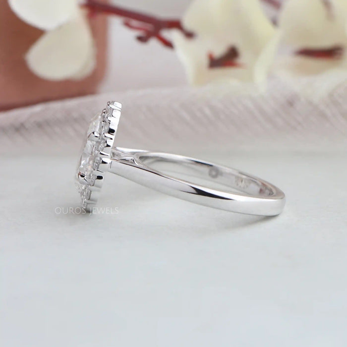 White gold band of oval halo diamond engagement ring