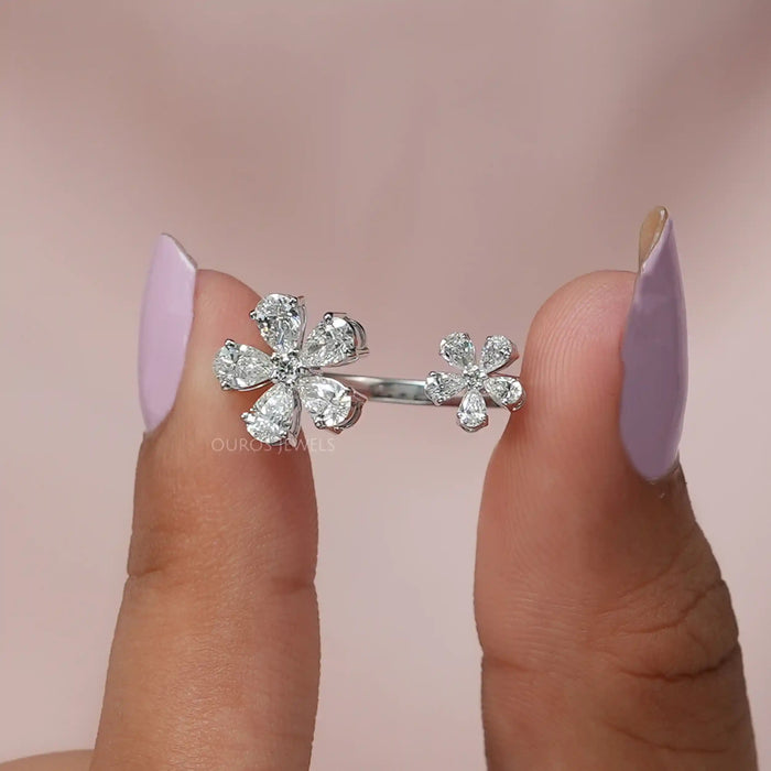 A close up look of vintage diamond flower cluster ring