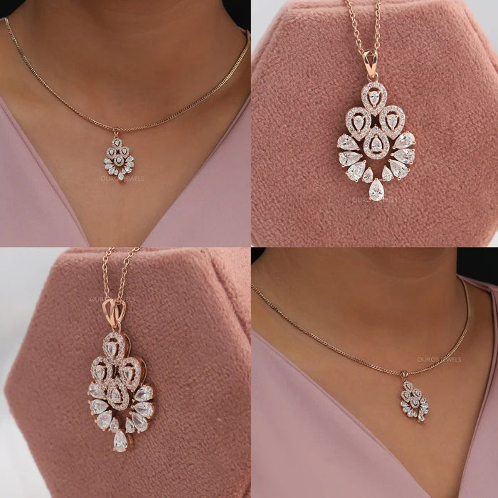 Floral style diamond halo pendant crafted with 14kt rose gold with a halo setting of round diamonds
