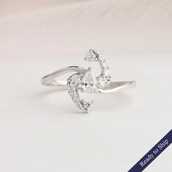 Pear shape lab grown diamond cluster engagement ring with bypass setting in 14k white gold
