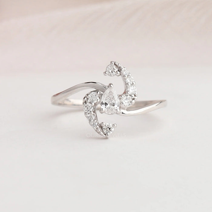 White gold lab diamond engagement ring with cluster of pear and round diamond