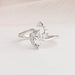 White gold lab diamond engagement ring with cluster of pear and round diamond