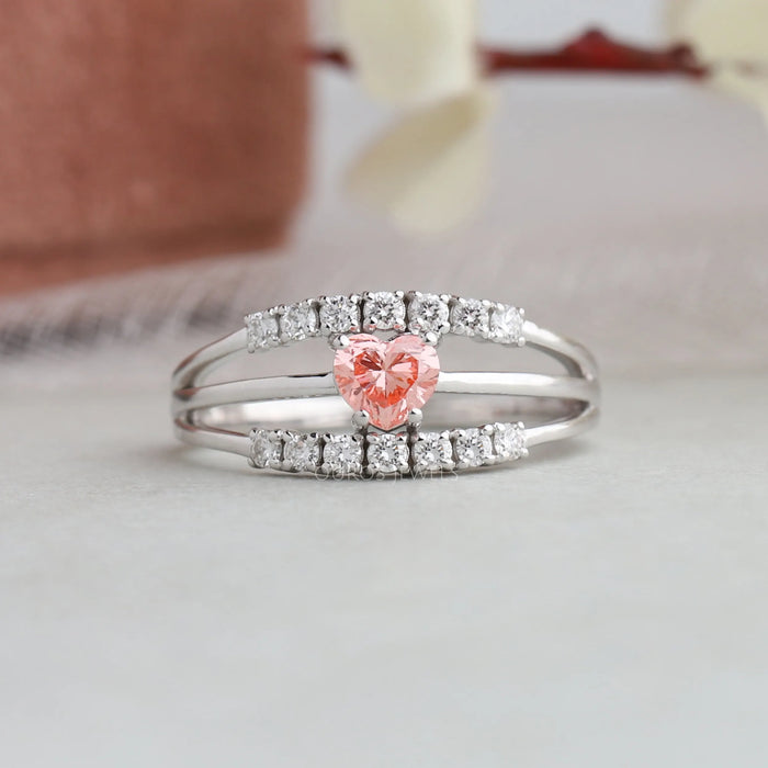 A close up look of Pink heart brilliant cut lab created diamond engagement ring with traditional four prongs 