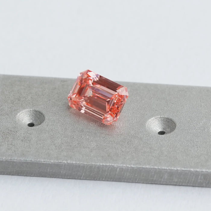 Unique emerald cut lab grown diamond with vivid pink color