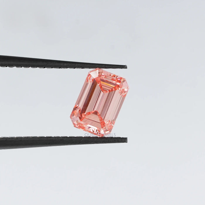 Pink emerald shape loose lab created diamond in tweezer