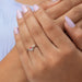 This pink princess cut diamond ring in 14k white gold.