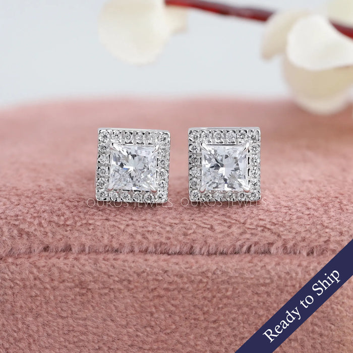 Princess cut lab grown diamond earrings with sparkling halo of round diamonds and claw prongs in 14k white gold