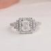 Elongated radiant cut diamond ring with brilliant halo of round diamonds