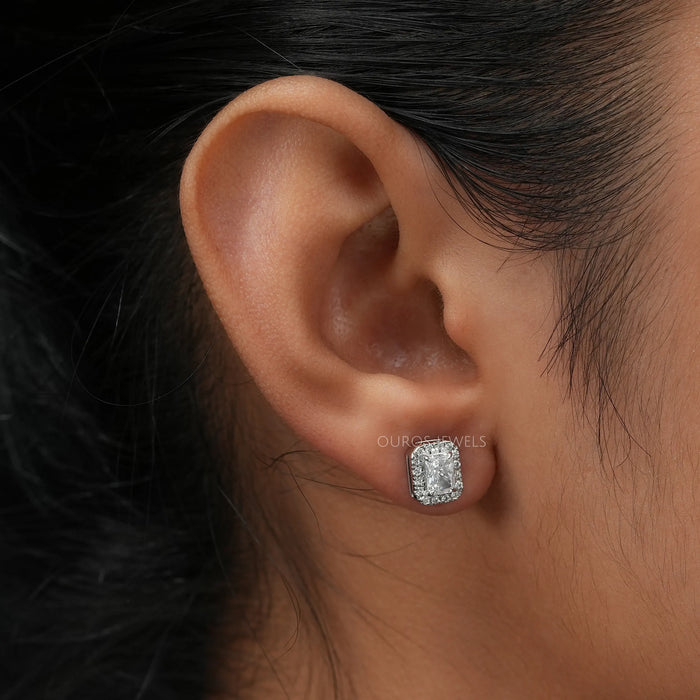 Radiant diamond studs in innovative halo setting and claw prongs, in ear look