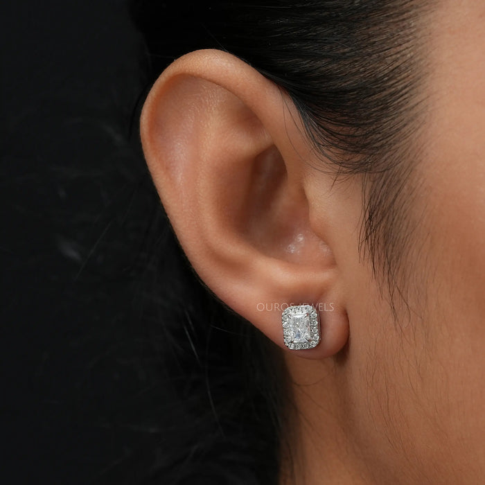 Solitaire stud earring set with radiant cut stone as well as a side halo, loaded with beauty and brilliance.