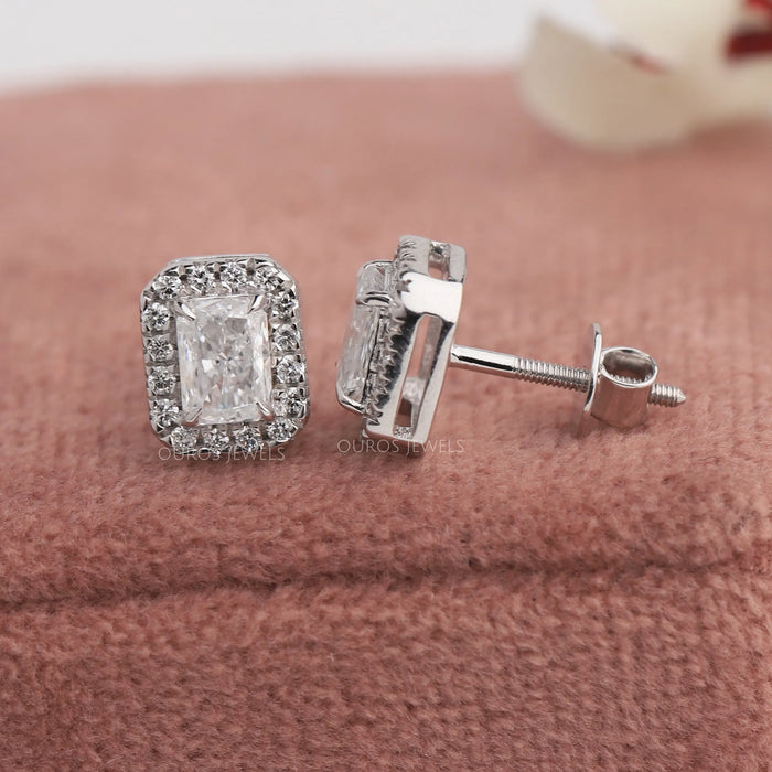Radiant cut lab grown diamond stud earrings with a halo setting and claw prongs with screw back back style