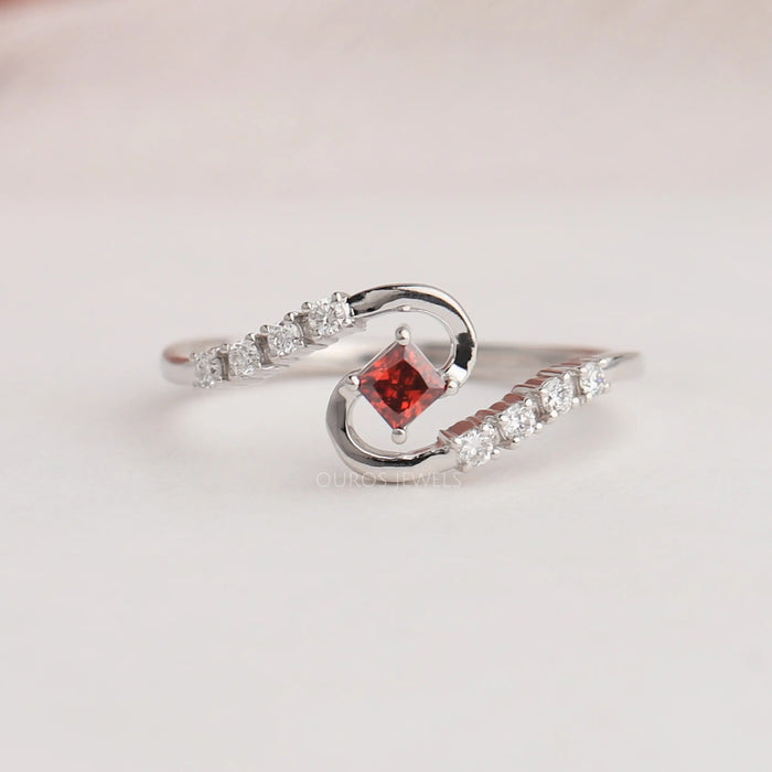 A Close Up Look Of Red Princess Curved Shank Diamond Engagement Ring