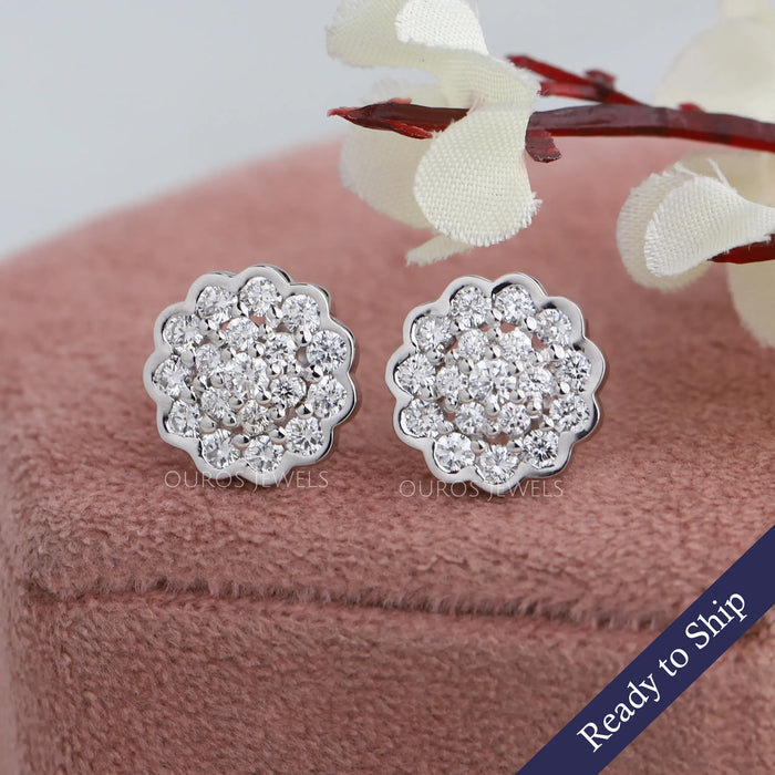Front view of flower shape round cluster earrings set in halo.