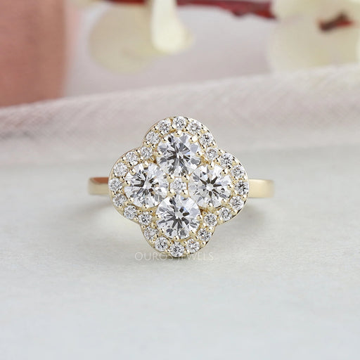 Flower shaped round diamond engagement ring with halo setting